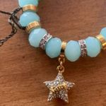Juicy Couture  Stretch Blue/Teal Beaded Charm Bracelet with Dangling Star Charm Photo 2