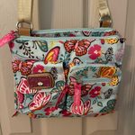 Lily bloom blue floral butterfly side sling crossbody adjustable shoulder bag. Photo 1
