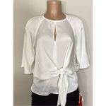 Vince Camuto New. ivory blouse bar top. Retails $89. Size XS. runs a little big. Photo 2