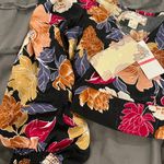 Band of Gypsies Vibrant floral design. Puff sleeves add elegance. Perfect for any occasion. Size XS Photo 1