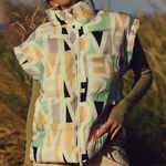 Free People NWT In A Bubble Printed Puffer Vest in Blocked Logo Photo 0