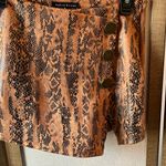 Haute Monde  Black and Orange Patterned pleather skort small Photo 3