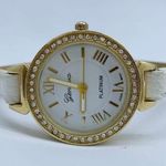 Geneva platinum woman’s 30mm gold tone watch rhinestones white dial runs Photo 0