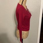 Divided Raspberry colored long sleeve shirt with lace up front. Photo 2