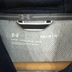 Under Armour Terry Fleece Blocked Hoodie With Hat Navy Blue White Gray Sz XS NWT  New with tag  Same day shipping  Smoke and pets free  This  hoodie is perfect for anyone looking for a comfortable and stylish addition to their wardrobe. With a navy blue, white, and gray color-blocked design and forest green and halo gray accents, this hoodie is sure to stand out. It features a hood and long sleeves, making it perfect for all seasons. The polyester material is breathable and durable, ensuring that it will last for years to come. The XS size is perfect for both men and women, with a regular fit that is comfortable and flattering. This hoodie is great for casual wear or for working out, and the fleece fabric provides added warmth on cooler days. Photo 6