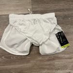 Nike standard Fit Women's White Shorts are a size XS. Photo 6