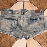 American Eagle  acid light wash studded denim booty shorts size 4 Photo 8