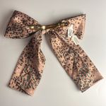 Anthropologie • Beige/Brown/Green Animal Print Bow Barrette Photo 1