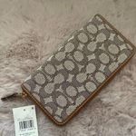 Coach Accordion Zip Wallet In Signature Textile Jacquard With Penguin Motif Photo 1