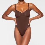 SKIMS  Thong Bodysuit Shapewear Seamless Sculpt Cocoa Photo 0