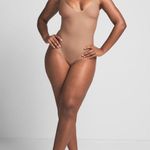SKIMS Body Unlined Plunge Thong Bodysuit in Sienna, Size Small Photo 0