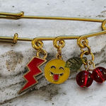 Gold Safety Pin with Charms Photo 0