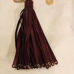 Michael Kors  Deep Chocolate Brown Tassel hang tag with Gold Hardware. Photo 2