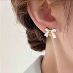 Elegant Gold and White Bow Earrings Photo 0