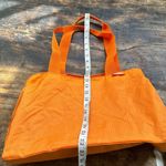 Baggallini  orange carry all nylon tote large with pink lining Photo 11