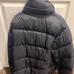 Northwest Territory Stay warm and stylish with this sleek black puffer jacket. Perfect for cold weather, it offers both comfort and fashion. Photo 4