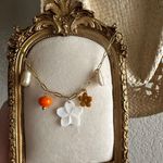 Beachy Orange Charm Necklace With Plumeria Flower Pendant Gold Photo 1