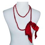Noonday red velvet bead bow necklace. Never worn Photo 0