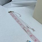 A.U. Ribbon and Hope Rhodium plated CZ necklace. Silver Photo 8