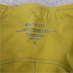 Athleta NWT  ultimate stash 7/8 pocket leggings mustard yellow gold xs Photo 4
