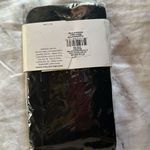 Jessica Simpson  two tone tights with bow motif Photo 1