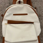 White and brown backpack Photo 0