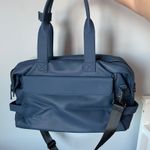 Calpak Hue Duffel Laptop Travel Bag in Atlantic Blue Color Faux Photo 5