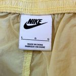 Nike Sportswear Project Uphoria Yellow Daisy Women's Nylon Woven Shorts Large Photo 6