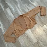 SKIMS  rhtf swim top rash guard or a top with jeans or shorts  Photo 1