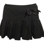 Chic Black Pleated Mini Skirt with Bow Detail Photo 0