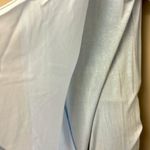 Lisa Rinna Asymmetrical Light Blue Shirt Horizontal and Lace Accents Photo 4