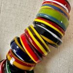 Colorful rings on fabric Indian necklace Photo 1