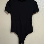 Popular 21 Short Sleeve Mock Neck Snap Bottom Bodysuit Photo 0