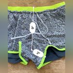 Nike Dri Fit Women’s Sz L Flex 2 in 1 Wolf Gray/Volt Speckled Running Shorts Photo 8