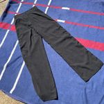 Romeo + Juliet Couture Romeo and Juliet Black dress pants with Red and white stripes at the side Photo 1