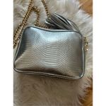 Victoria's Secret Victoria secret silver crossbody purse w gold chain and tassel Photo 3