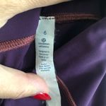 Lululemon  Eggplant with light purple stitching 7/8 Leggings. Size 6 Photo 7