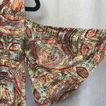 Veronica M  - shirt with shoulder cut out. Photo 1