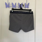 Under Armour NWOT | Under‎ Armour women’s gray compression shorts — medium Photo 1