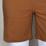 We Wore What ‎ Nylon Biker Short in Gold Photo 3