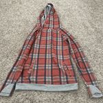 &Ave size xs burnt orange and blue plaid hoodie with thumb holes in the sleeves Photo 0
