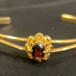 Gold Floral Bracelet with Red Gemstone Photo 0