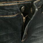 Tractr: Stretchy Skinny Jeans with red flannel covered holes Photo 12