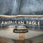 American Eagle  High Rise Jegging X-Long Sz 4 Distressed Whiskered Medium Wash Photo 1