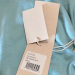 #23 NWT MOTHER Denim The It's A Cinch Side Ruched Tee in Eggshell Blue Size M Photo 5