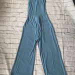 Women M sleeveless wide leg Flowy jumpsuit w/tie belt blue Size M Photo 6