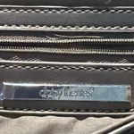 Daisy Fuentes  NWOT bronze handbag with silver details Photo 6