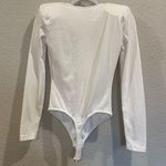 GRLFRND Eryka Long Sleeve Jersey Knit Paddle Thong Bodysuit in White Photo 9
