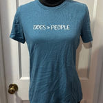 Bella Canvas Dogs Over People Blue Graphic Short Sleeve Top in S Photo 0