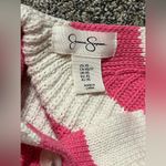 Jessica Simpson , pink and off-white striped cropped cardigan.￼ Photo 5